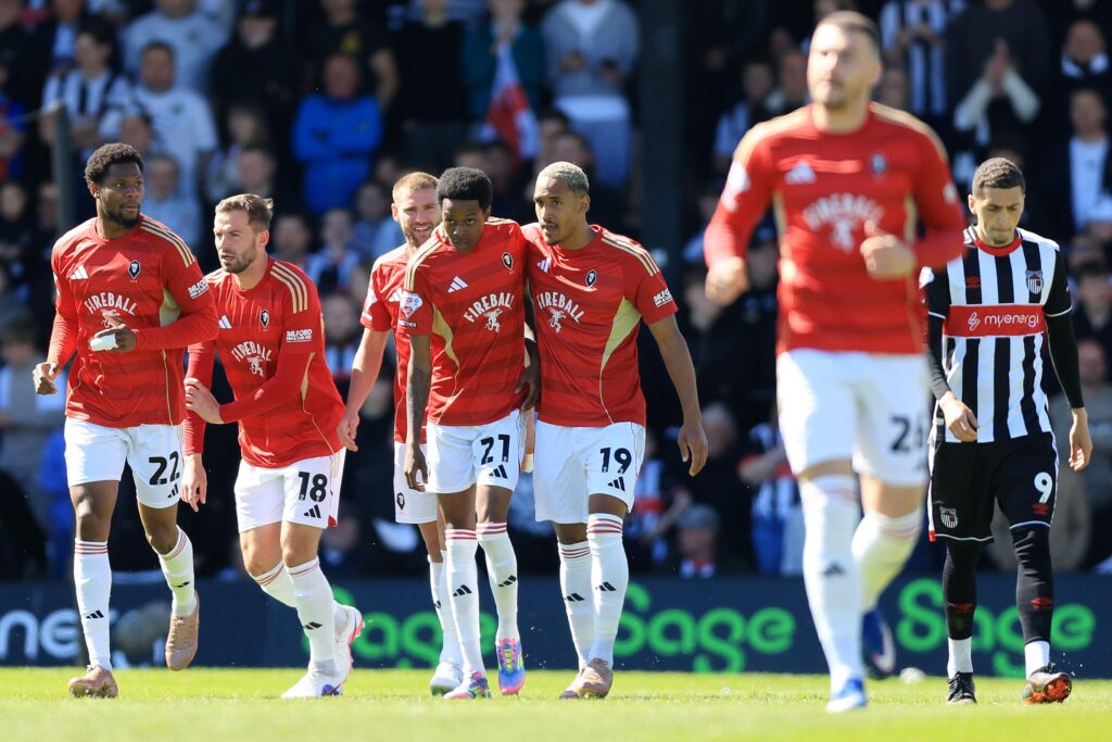 Salford City celebrate scoring against Grimsby