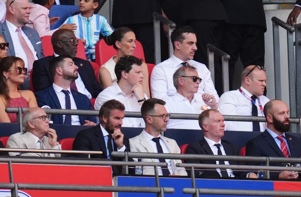 3EHMC6D Salford City co-owners Sir David Beckham (front second left) and Gary Neville (top right) with Paul Scholes (front second right) in the stands during the Sky Bet League Two play-off final at Wembley Stadium, London. Picture date: Monday May 25, 2026.