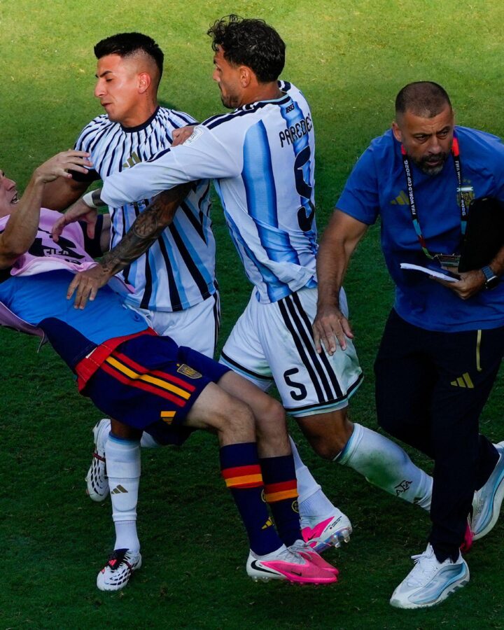 3F2P3EY Spain's Gavi, left, falls as he scuffles with Argentina's Leandro Paredes (5) and Thiago Almada during the World Cup final soccer match between Spain and Argentina in East Rutherford, N.J., near New York, Sunday, July 19, 2026. (AP Photo/Yuki Iwamura)